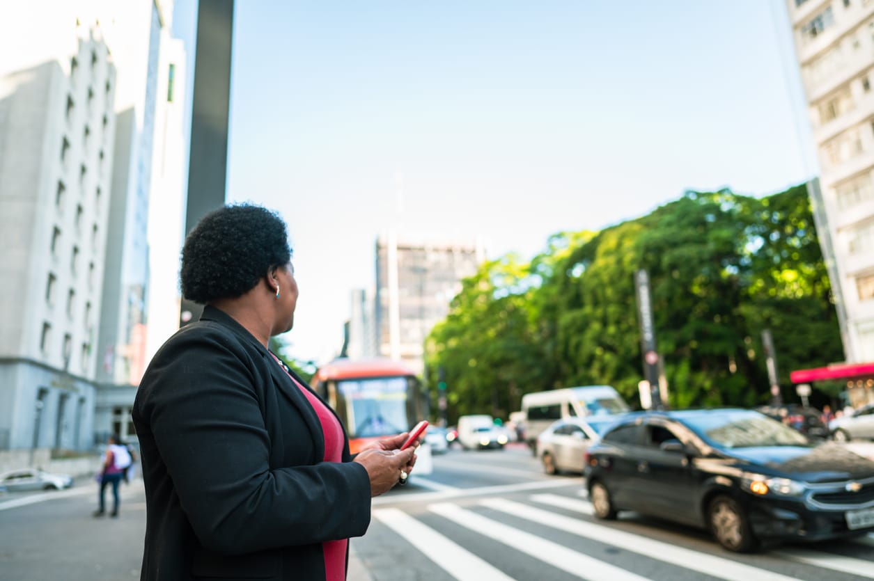 Woman about to cross the street.