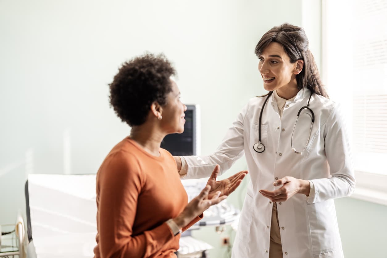 Audiologist discussing hearing health with a patient.