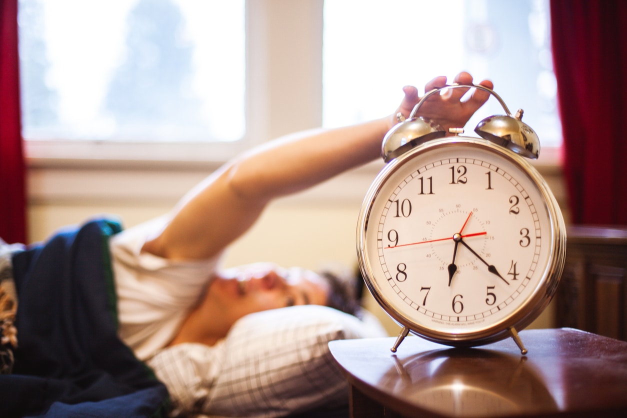 Woman turning off her alarm.