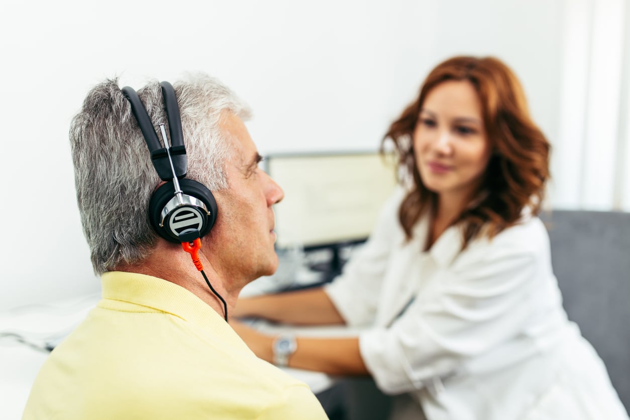 Man taking a hearing test.