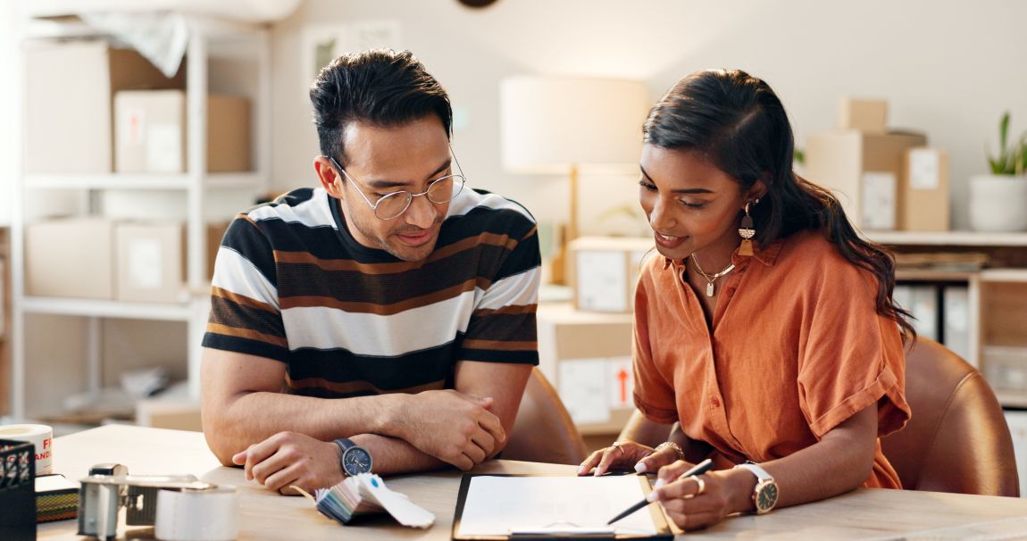 man and woman looking at information on a clipboard about laryngitis